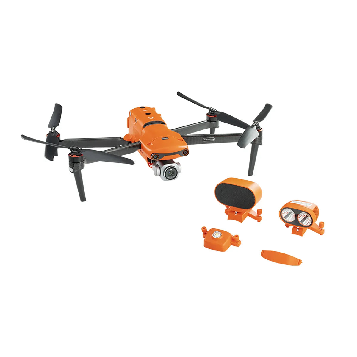 Orange drone with propellers and additional accessories including spotlight and speaker attachments.