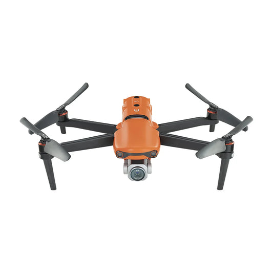 Front view of an orange drone with extended propellers and integrated camera.