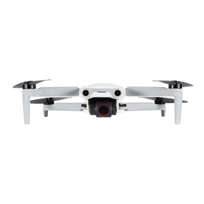 White Autel EVO Nano drone in mid-flight, side view with camera